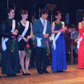 Prom or formal dance event with students in evening attire.