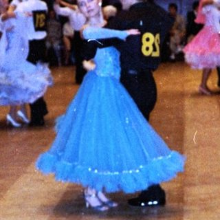 Children dancing in a ballroom competition.