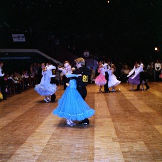 Children dancing in a ballroom competition.