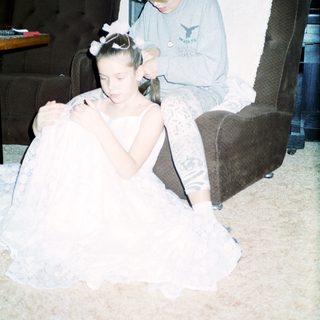 Two people preparing for an event indoors.