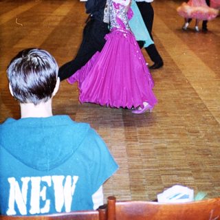 Ballroom dance competition with couples performing.