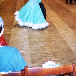 Dance competition with participants in colorful costumes.