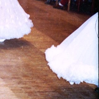 Ballroom dance competition with couples performing.