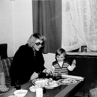 Family gathering around a meal indoors.