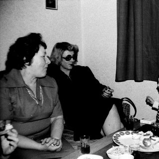 Family meal scene with two adults and a young child.