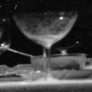 Couple watching film in darkened theater.
