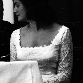 Couple seated together at a formal event.