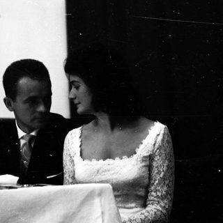Couple seated together at a formal event.