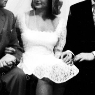 A wedding group portrait from the mid-20th century.