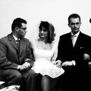 A wedding group portrait from the mid-20th century.
