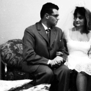 A wedding group portrait from the mid-20th century.