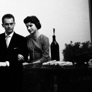 A wedding group portrait from the mid-20th century.