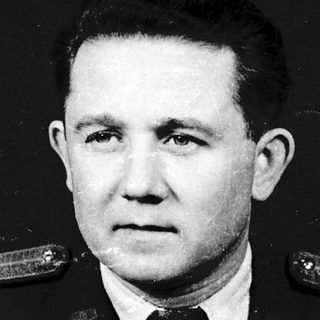 Military officer in formal portrait photograph.