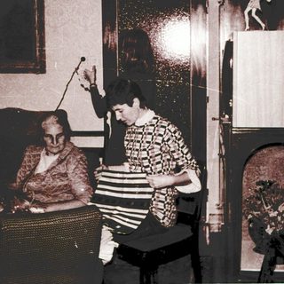 Two women playing Wii in a living room.