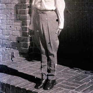 Vintage photograph of man in early 20th-century attire.