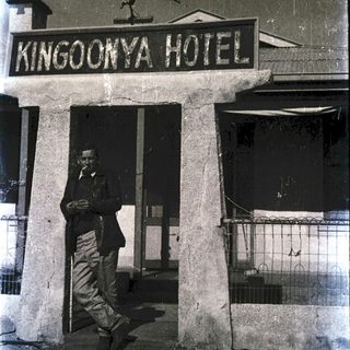 Man standing outside Kingoonya Hotel entrance.