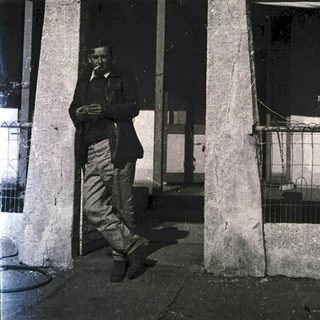 Man standing outside Kingoonya Hotel entrance.