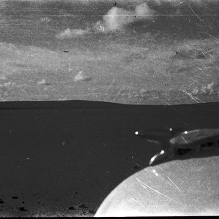 Surface of the Moon with lunar horizon and Earthrise.