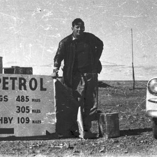 Shell petrol station sign with distances to nearby towns.