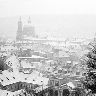 Historic European city covered in snow.