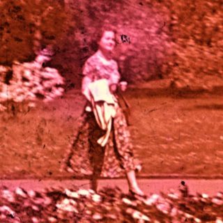 Vintage photo of person playing golf outdoors.