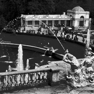 Elegant historic garden fountain with classical sculptures.