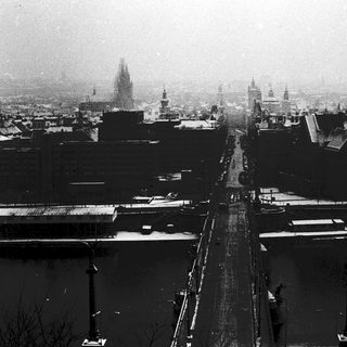 Snow-covered city street during winter.
