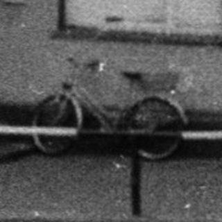 Historical black-and-white photo of a municipal pharmacy building.