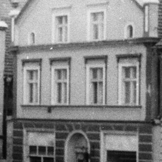 Historical black-and-white photo of a municipal pharmacy building.