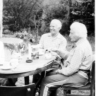 Four people enjoying a meal outdoors together.