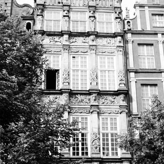 Baroque-style ornate building facade with statues.