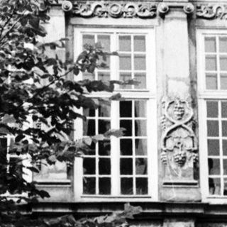 Baroque-style ornate building facade with statues.
