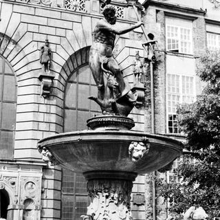 Baroque fountain with mythological figures and ornate basin.