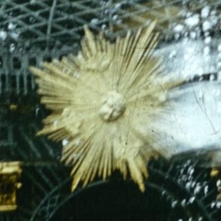 Blurred motion of Ferris wheel and decorative star.