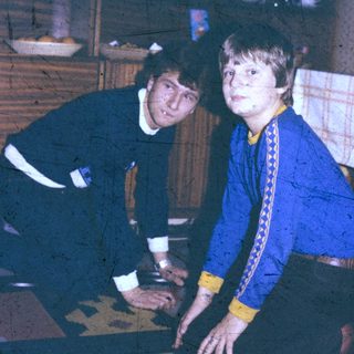 Two people playing board game indoors.