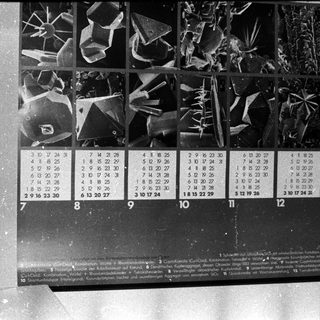 Calendar with lunar phase and moon age illustrations.