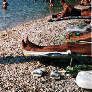 Person mid-air diving into clear water.