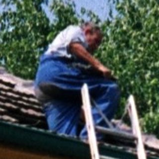 Ladder leaning against building for exterior maintenance.
