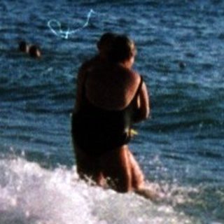 Surfer riding powerful ocean wave.