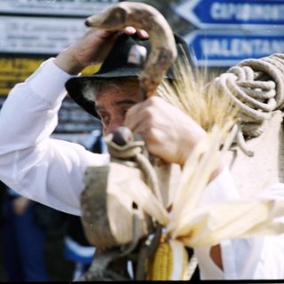 Man participating in traditional bull-rope twisting event.
