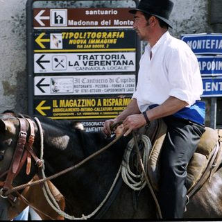 Traditional Italian horseback riding event with riders.