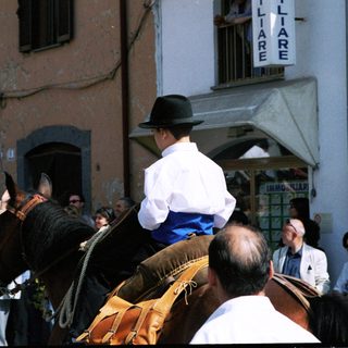Traditional equestrian procession in a town square.