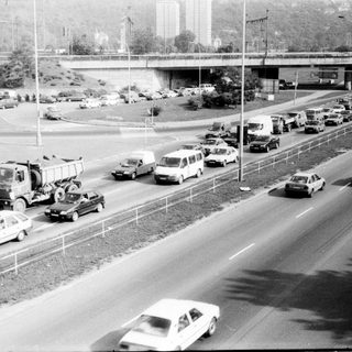 Traffic jam with construction vehicle on highway.