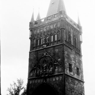Historic stone clock tower with Gothic architectural details.