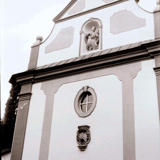 Neoclassical church facade with religious relief.