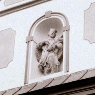 Neoclassical church facade with religious relief.