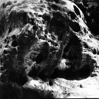 Rough, jagged surface of a comet nucleus.
