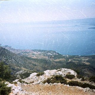 Scenic coastal mountain landscape with ocean view.