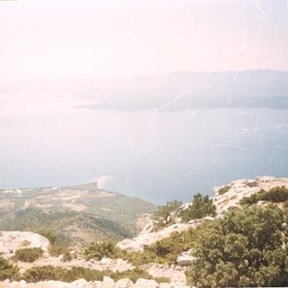 Scenic coastal mountain view overlooking sea.