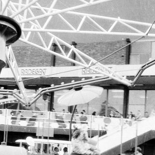 Amusement park ride with suspended seats.